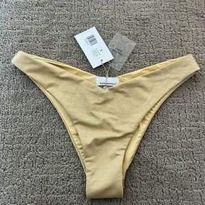 NWT “We Wore What” gold swim bottoms SZ small
